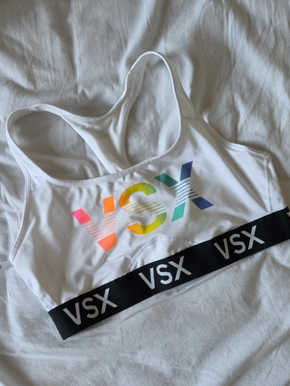 VSX White Sports Bra with Rainbow Gradient Logo and Black Elastic